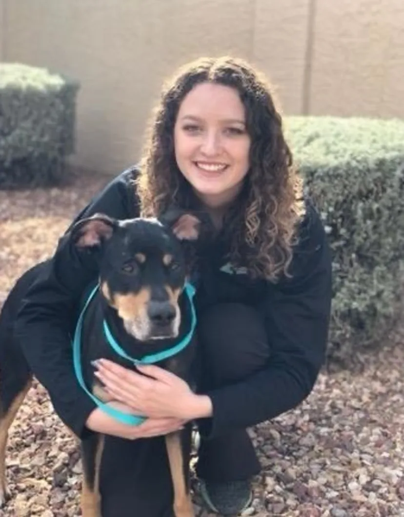 Allison and black dog- Lead CSR at Arizona Avenue Animal Clinic